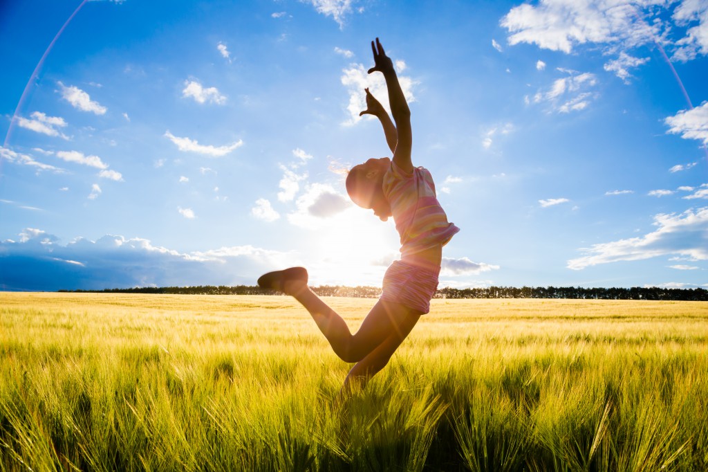 jumping kid on the field