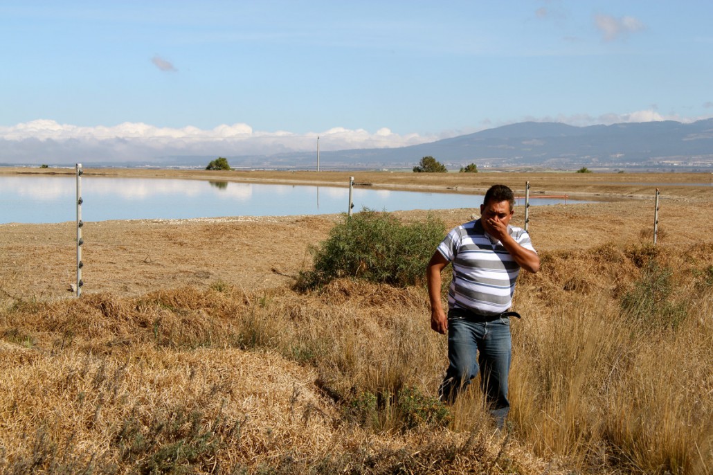 If photos could smell. Local resident covers him mouth in disgust at smell of GCM lagoon Perote