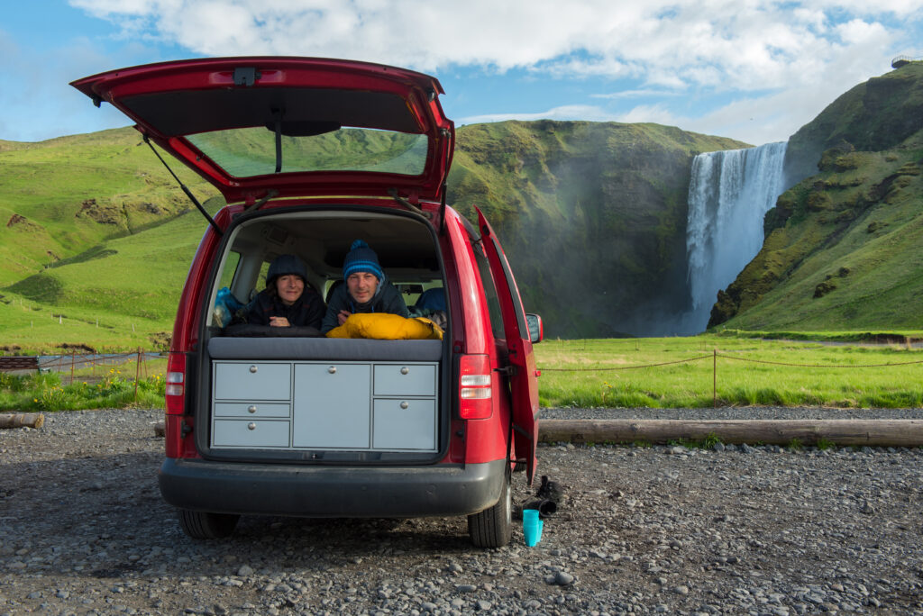 Couple Relaxing In A Red Minivan Skogafoss Waterfall Iceland original 2532680